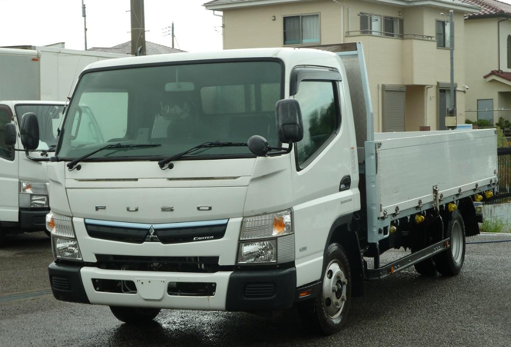 White Mitsubishi Fuso Canter tray truck